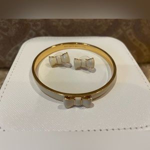 Kate Spade white and gold bow bangle and earrings.